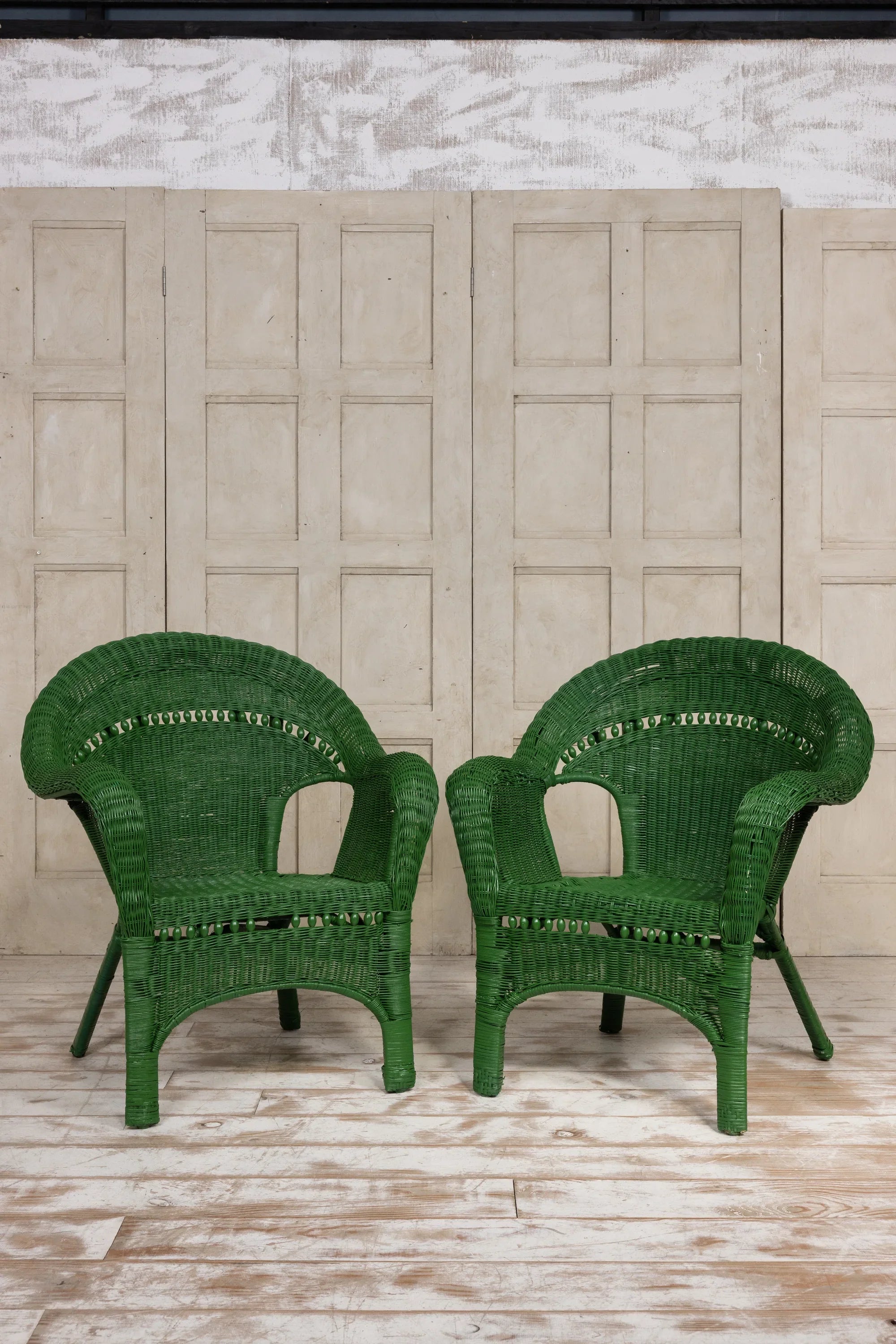 Pair of vintage coastal woven rattan lounge chairs. 1920's